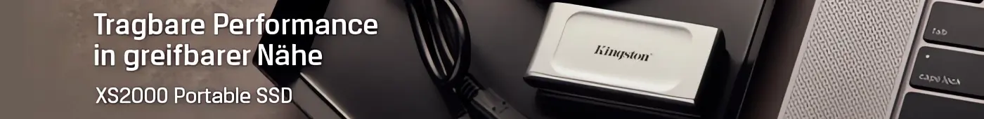 Kingston XS2000, tragbare SSD mit Geschwindigkeiten von USB 3.2 Gen 2×2. Kingston XS2000, tragbare SSD mit Geschwindigkeiten von USB 3.2 Gen 2×2. Visual der XS2000, die neben einem Notebook liegt.