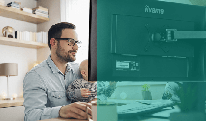 Future-X iiyama Zubehör für LFD & Desktop  Future-X iiyama Zubehör - Ein Mann mit einem Kind im Arm arbeitet an einem Computer